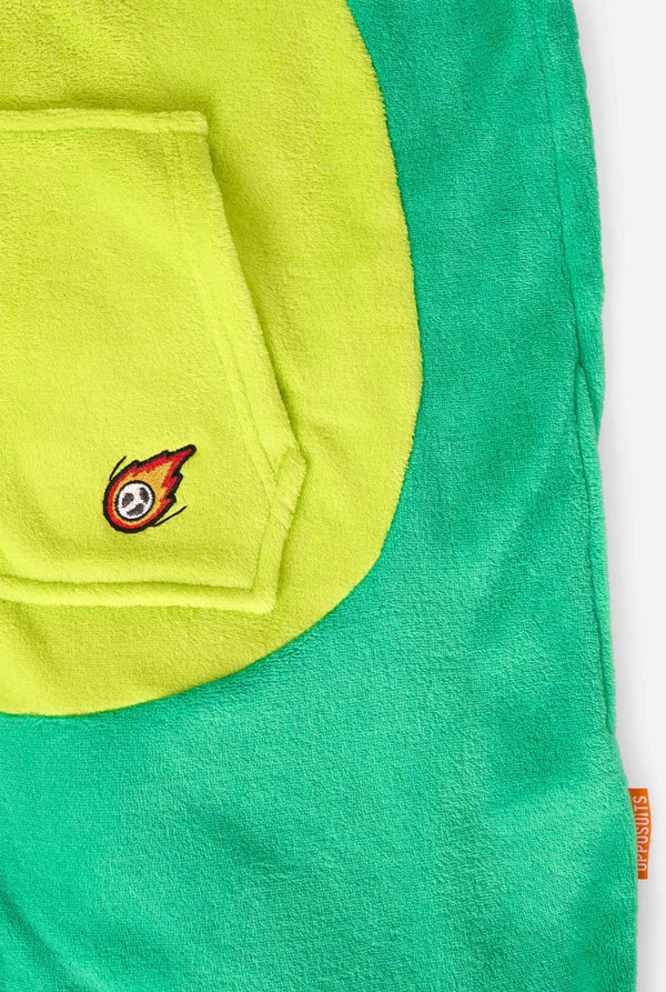 Kid is wearing green dino onesie for kids. Close up.