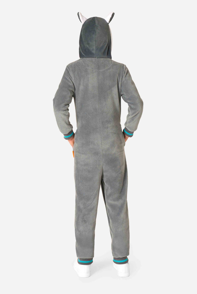 Child wearing a cozy unisex kids onesie designed as a lemur, featuring grey and white plush fabric, a hood with a cartoon lemur face and ears, and a playful banana print on the pocket. View from the back.