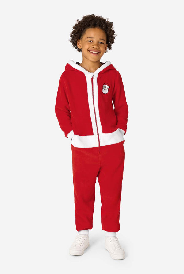 Kid is wearing a red Christmas Santa onesie, resembling a Santa suit with a hood and santa logo.