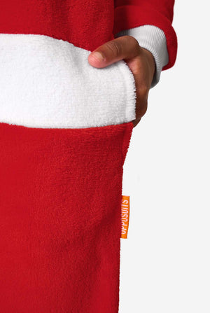 Kid is wearing a red Christmas Santa onesie, resembling a Santa suit with a hood and santa logo.
