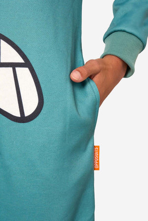 Child wearing a teal SpongeBob Plankton onesie on a light background