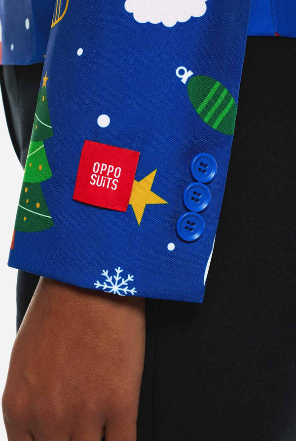 Woman wearing blue Christmas blazer for women, with Christmas icons on it.