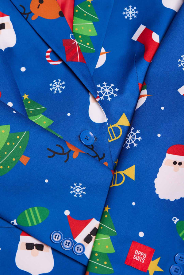 Woman wearing blue Christmas blazer for women, with Christmas icons on it.