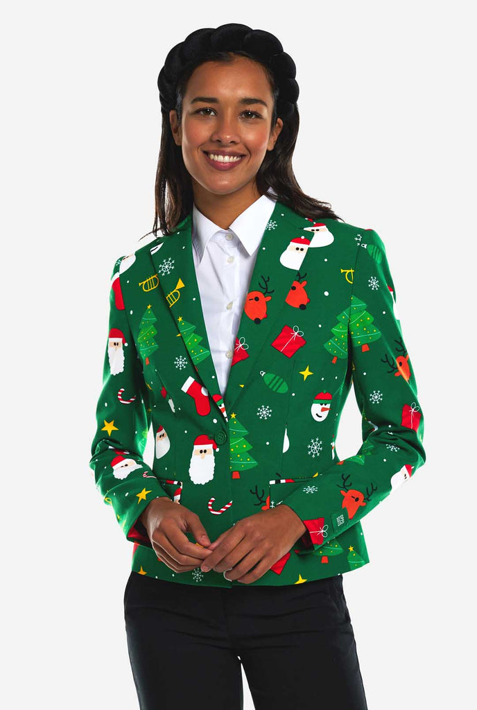 Woman wearing green Christmas blazer for women, with Christmas icons on it.