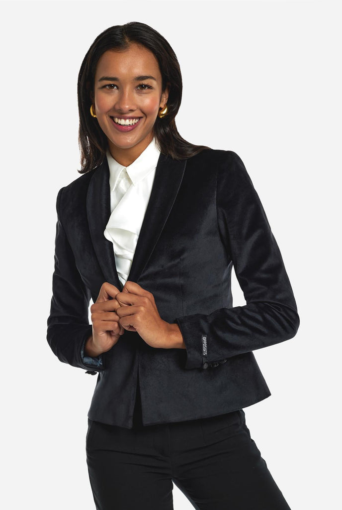 Woman wearing black velvet dinner jacket blazer