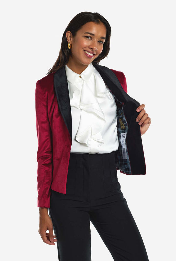 Woman wearing burgundy red velvet dinner jacket blazer