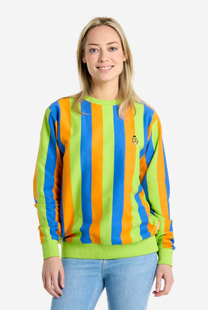 Person wearing a colorful striped sweater with a plain background