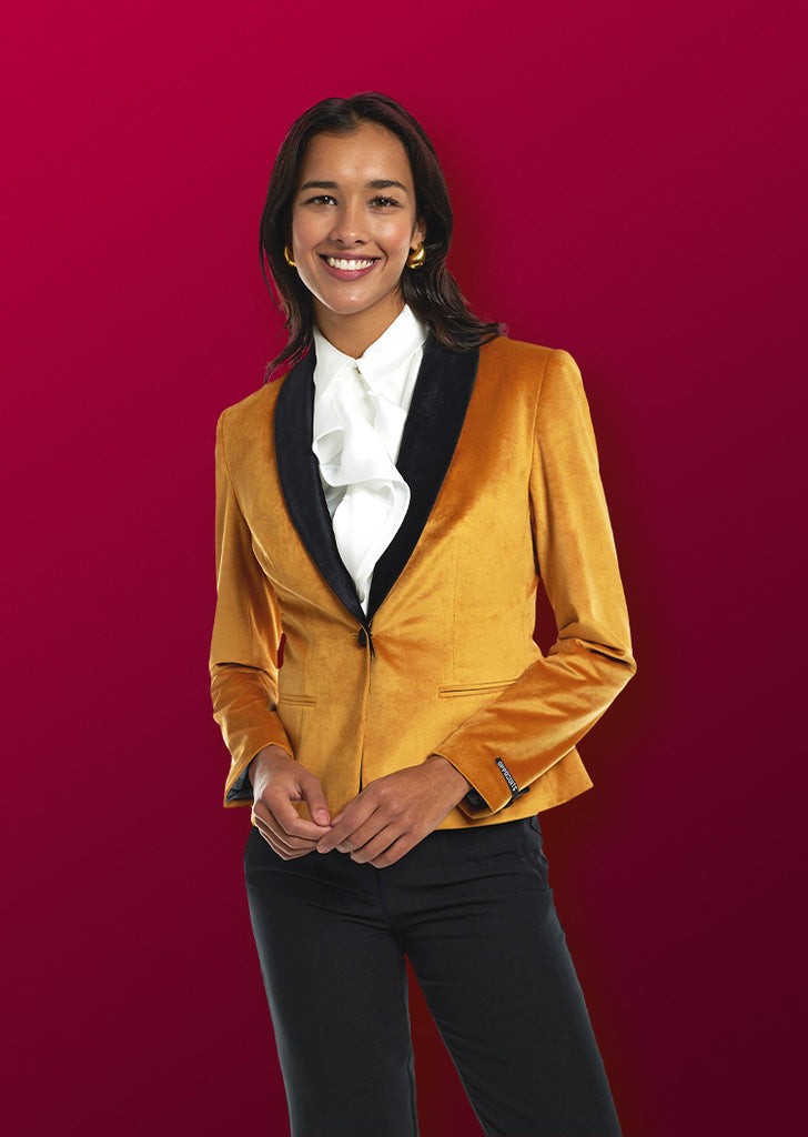 Woman wearing golden dinner jacket blazer