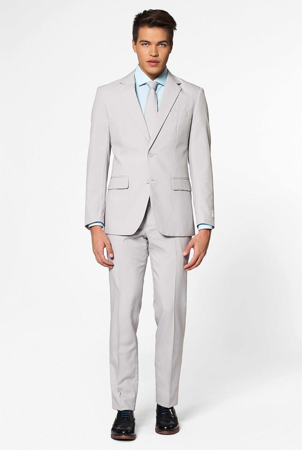 Solid color light grey men's suit Groovy Grey worn by man. Upper body image.