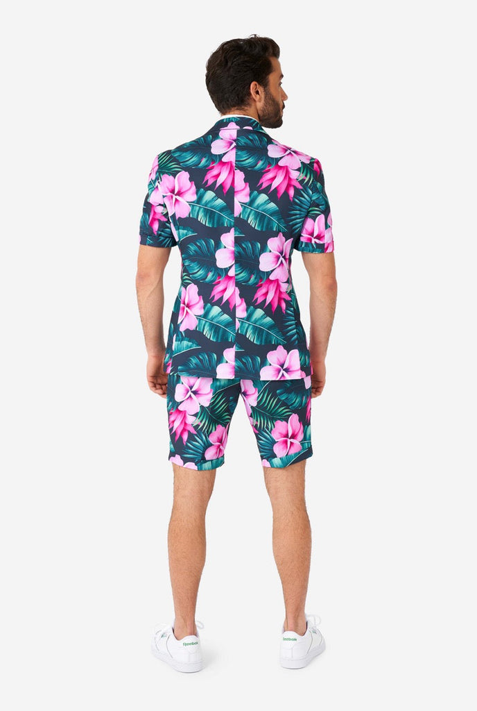 Man wearing blue summer suit with pink flowers in Hawaiian print