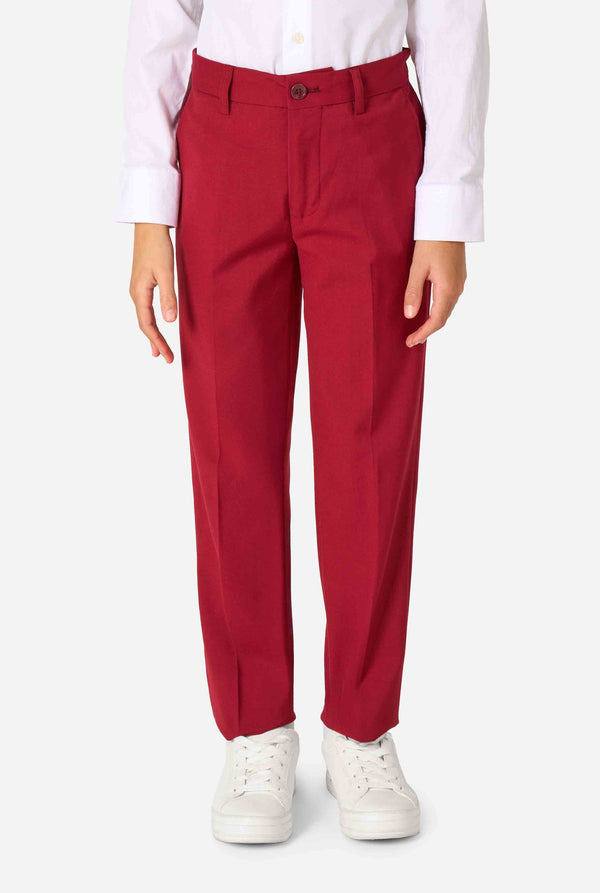 Kid wearing a stylish burgundy red suit with a white dress shirt, looking confidently. Perfect formal outfit for boys' special occasions, weddings, and parties. Pants close up.