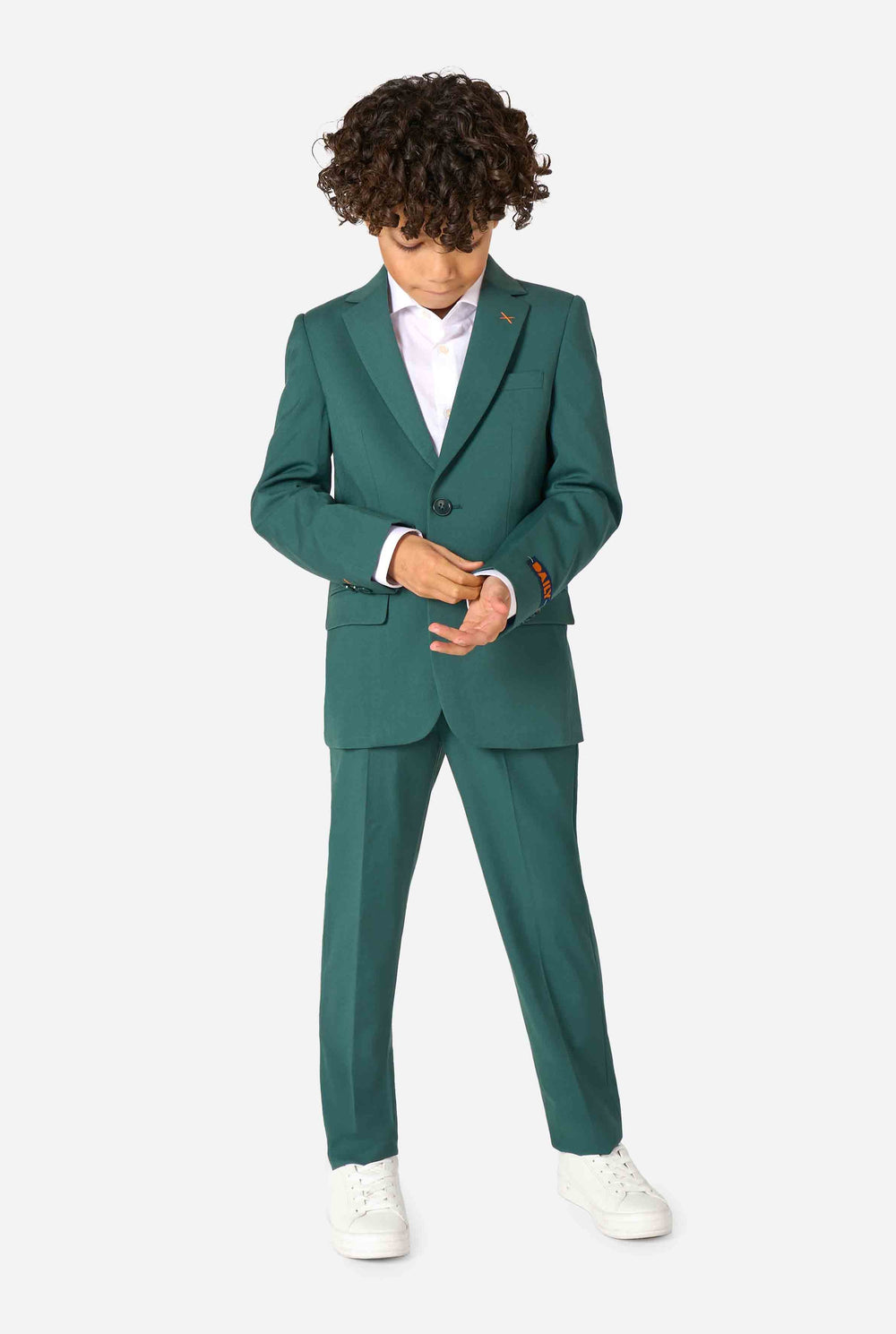 Kid wearing a stylish dark green suit with a white dress shirt, looking away from the camera. Perfect formal outfit for boys' special occasions, weddings, and parties.