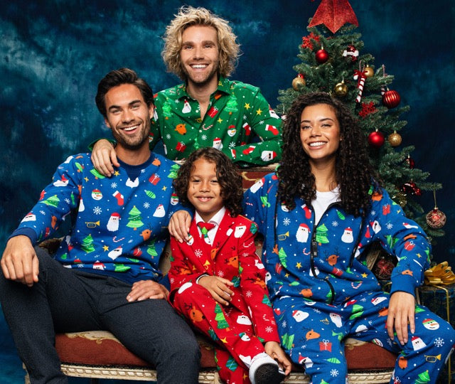 An image of 4 persons sitting on a couch wearing Festivity christmas products.