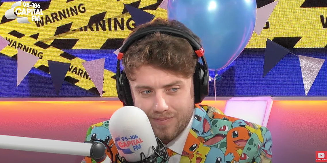 Guy wearing Pokemon OppoSuits suit on radio