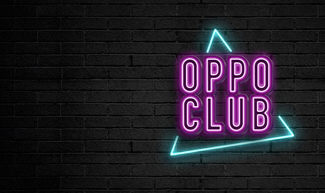 Image resembling a black brick wall with the logo OppoClub in purple neon.