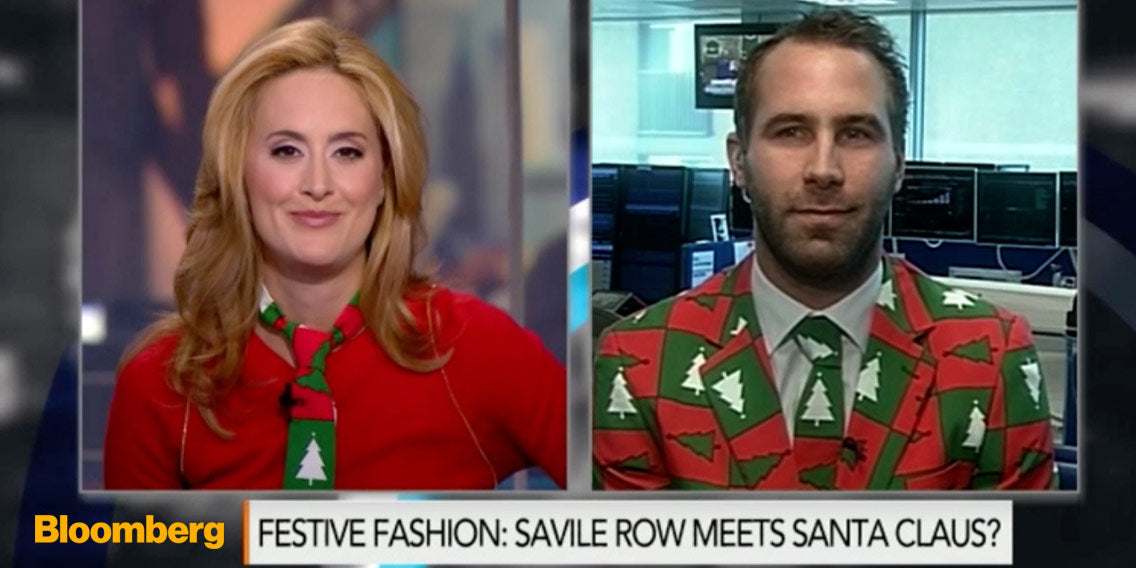 OppoSuits founder on television wearing OppoSuits suit