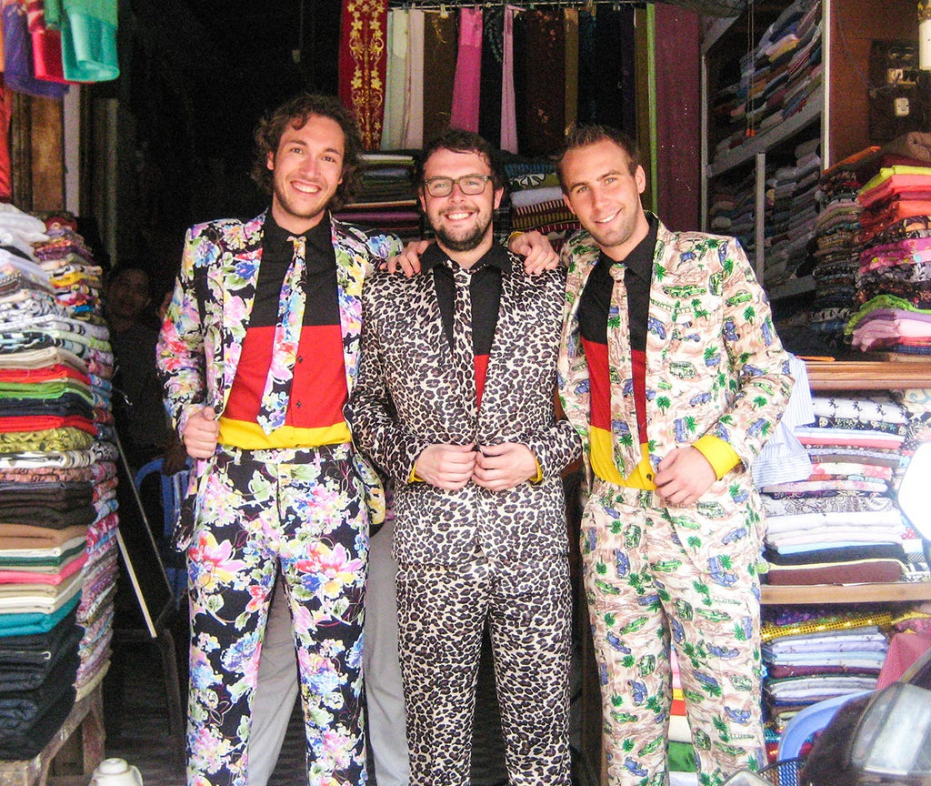 OppoSuits founders in front of fabric store in Vietnam