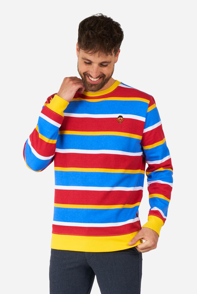 Man wearing Men's Sweater with iconic Sesame Street Ernie pattern with Yellow, red, blue and white stripes