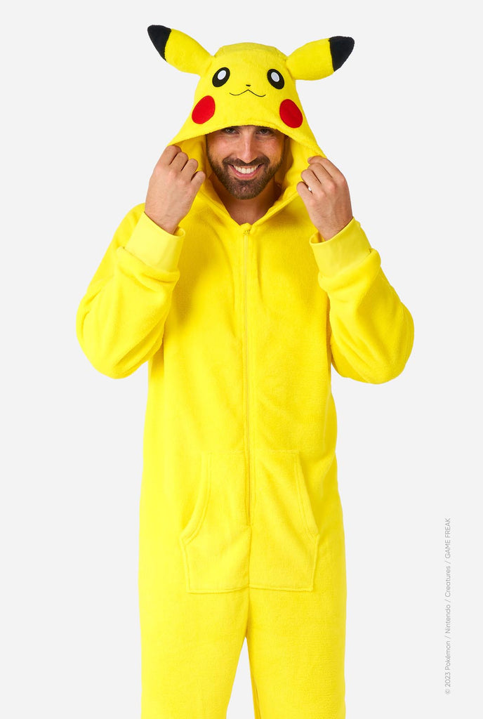 Man wearing yellow Pokemon Pikachu Unisex Adult onesie 