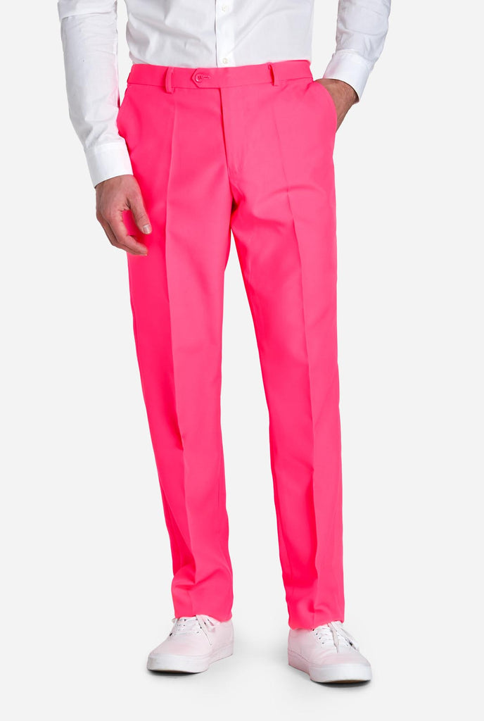 Man wearing neon pink men's suit, pants view